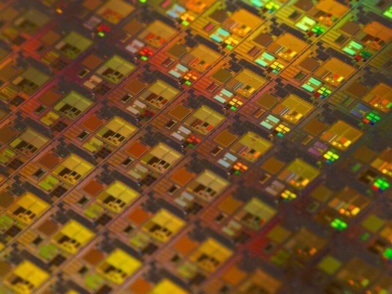 Semiconductor Stocks Rising On Ai Demand: What’s Fueling The Market Rally? 1 A Close Up Of A Pattern Of Small Squares