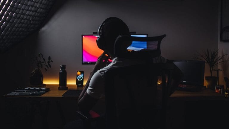 How Creators Are Monetizing Sora Ai Videos 2 A Person Wearing Headphones Sitting In Front Of A Computer