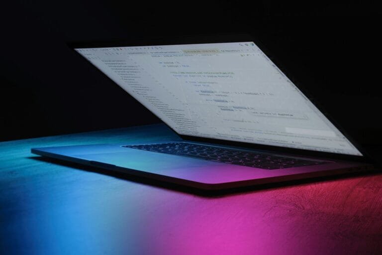 Responsible Ai Development: Industry Best Practices 1 Open Laptop With Code On Screen, Neon Lighting