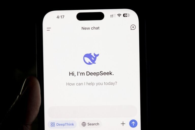 What Is Deepseek? A Complete Guide To Its Ai Models And Capabilities 10 A Person Holding A Cell Phone In Their Hand